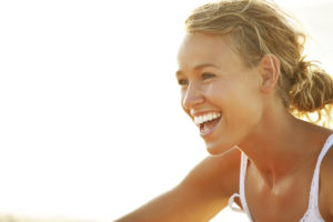 young woman smiling no makeup