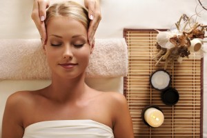 attractive female getting recreation massage of head