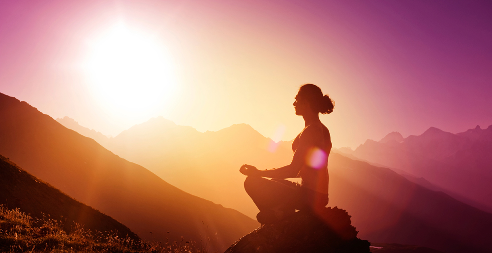 Man-Meditating-Cliffside