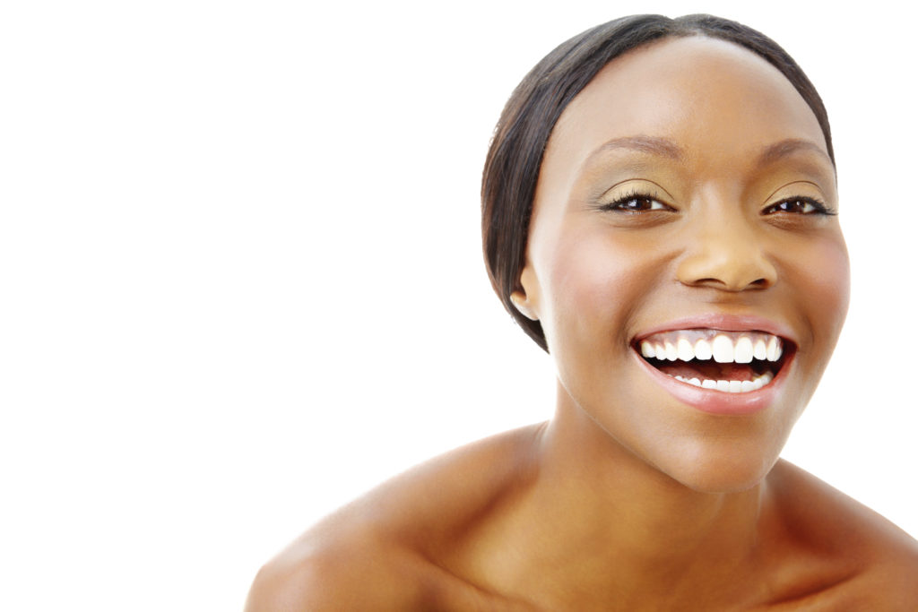 a pretty young nude woman on a white background