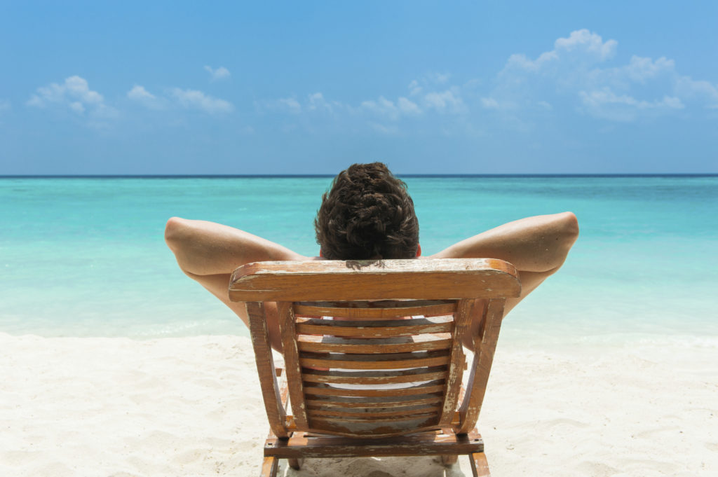 man resting on the beach