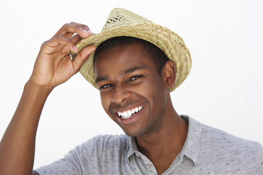 Happy fashionable man smiling with good skin