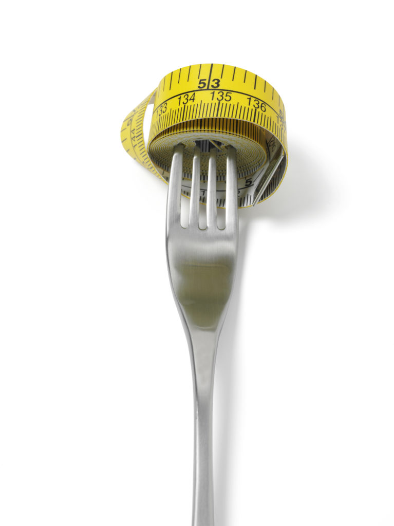 Tape Measure Wrapped on a Fork