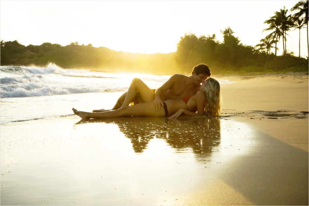 couple-embracing-sand-beach