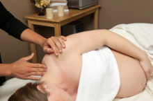 prenatal massage on pregnant woman