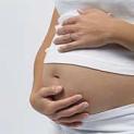 pregnant woman holding her stomach