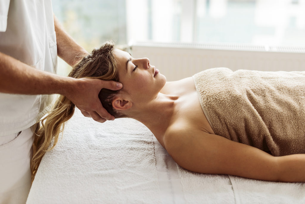 woman on table receiving a thai massage