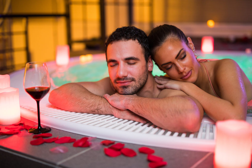 couple-relaxing-hot-tub