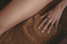 woman-lounging-sand