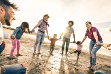 families-holding-hands-beach