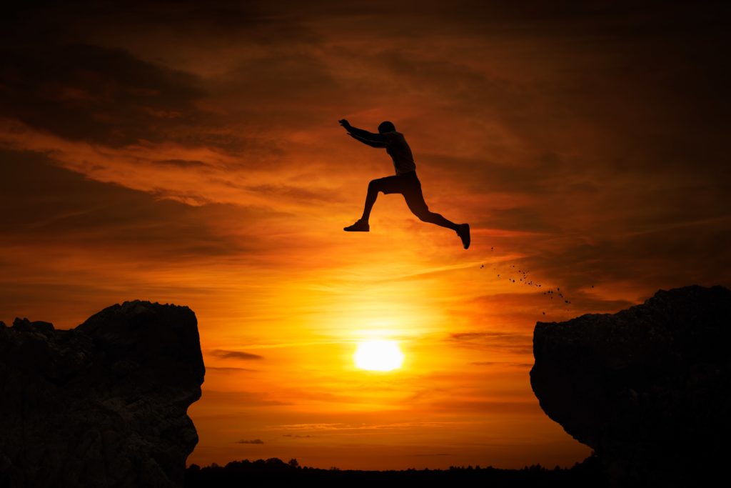 man-leaping-sunset