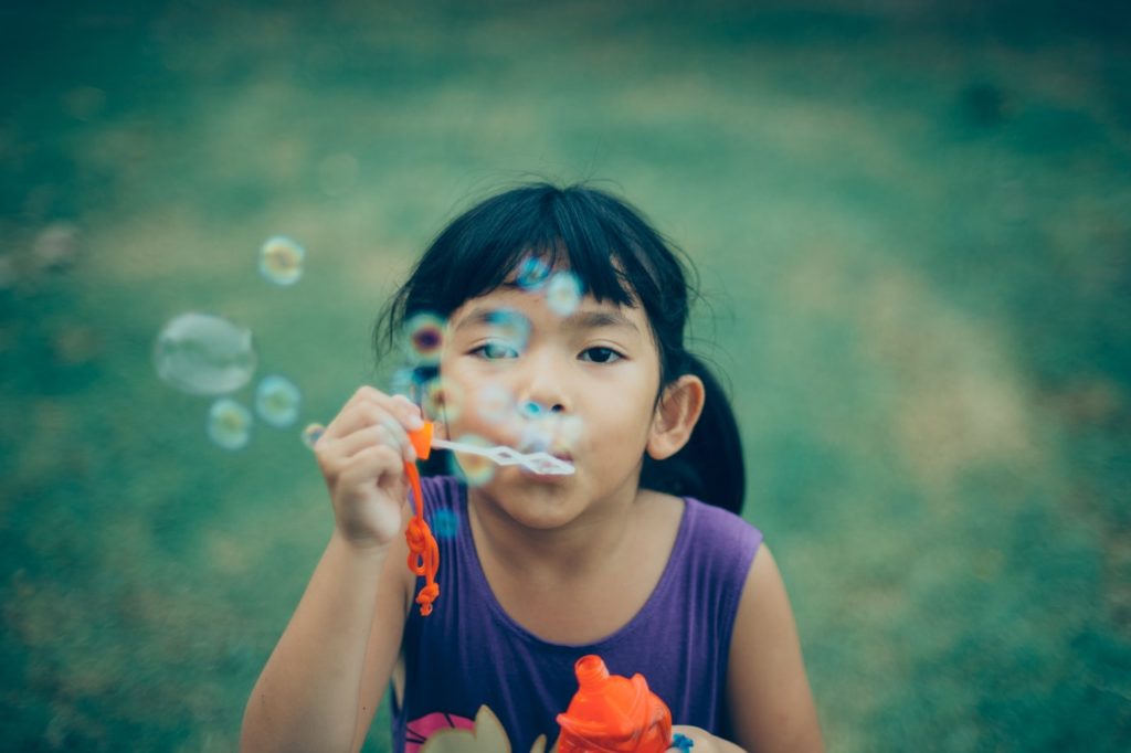 girl-blowing-bubbles
