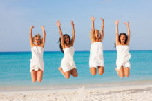 girlfriends-jumping-beach