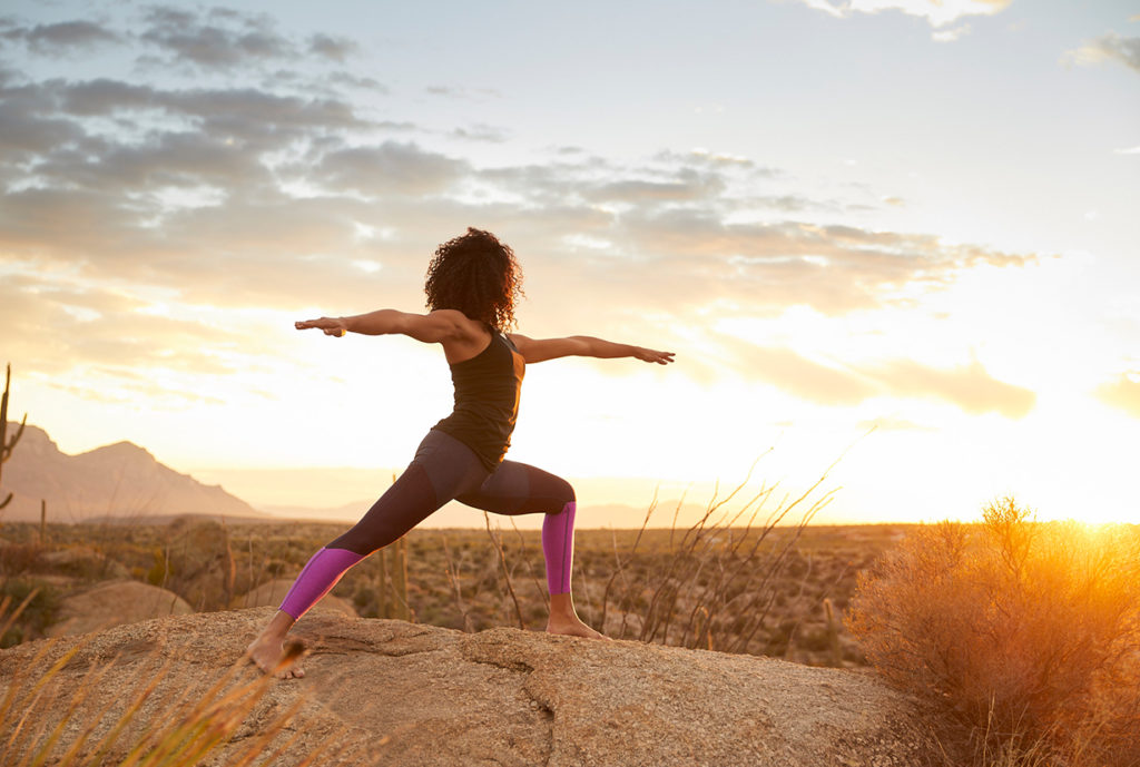 woman-yoga-sunset