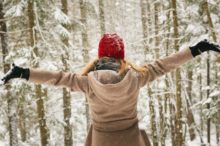 woman-arms-outstretched-winter