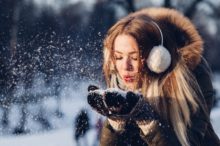 woman-blowing-snow