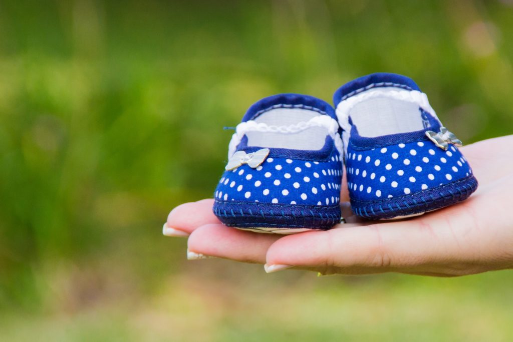 holding-baby-shoes