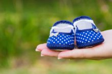 holding-baby-shoes